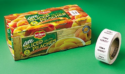 The upstream unit of the two-labeler setup is applying the label (above) to the top of the multipack of canned fruit or vegetabl