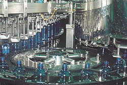 The 128-valve filler handles 20-oz bottles at 1,000/min.