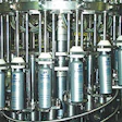 Backside view shows the cam-operated platforms under each bottle that raise and lower during the filling cycle to minimize splas