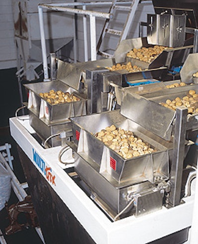 The twin-head scale system, shown up close (above) and from a distance (left) has helped reduce giveaway of bulk in-shell nuts b