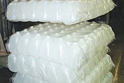 Lengthy line starts with robotic depalletizing where the bagged jugs are picked and placed onto an infeed table for automatic de