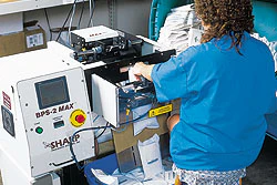 Statcorp's new packaging system (above) requires just one operator and the new bagger/printer combo.