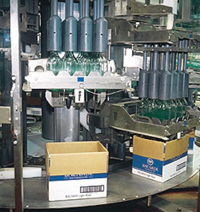 Bottles are removed from reshippers by a continuous-motion rotary-style uncaser (left).