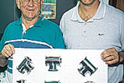 Dutch (left) and Don LaJeunesse hold a skin-packed pad of stainless-steel components in front of their company's new skin packag