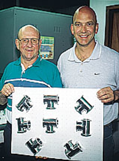 Dutch (left) and Don LaJeunesse hold a skin-packed pad of stainless-steel components in front of their company's new skin packag