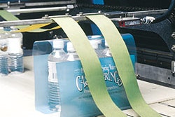 New printed shrink film unsupported bundles (left) offers the company new merchandising possibilities, while the tray overwrap s