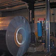 While rotating on powered rollers, a 36,000-lb steel coil is stretch wrapped in 2-mil LLDPE film treated with vapor corrosion in