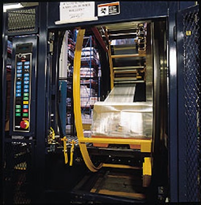 The first of two stretch wrappers used by Spencer Press is this orbital machine that applies film around the top, bottom, and tw