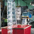 The converting machine (left) produces air-filled cushions a maximum width of 8', with length varying from 3' to 20'. Omron Heal