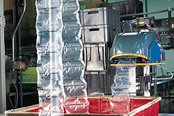 The converting machine (left) produces air-filled cushions a maximum width of 8', with length varying from 3' to 20'. Omron Heal