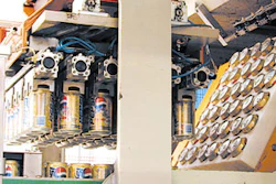 In this photo, the central feed wheel (right) has just been loaded with 36 cans, and the pickup head (left) is ready to load aga