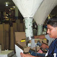 Aworker at Niles, IL-based e-commerce fulfillment firm Marketing Out-of-the-Box prepares a direct-to-consumer order for shipment