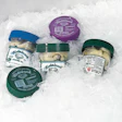 Since new labels and a large plastic cap were made part of the package, the container has much better impact on display. Inset s