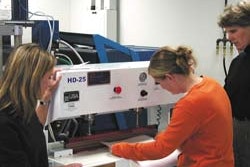 Alison Kayser (left), DuPont, medical packaging engineer and Rochester Institute of Technology alumna, and Maura Scanlon, packag