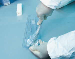 The bagged hip stem is twisted into place into an undercut in the inner tray (above). This secures the metal part for distributi