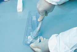 The bagged hip stem is twisted into place into an undercut in the inner tray (above). This secures the metal part for distributi