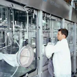 Glove ports allow operators to make adjustments at key machine areas.
