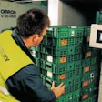 Wheeled dollies (top) of reusable plastic crates filled with chilled foods are rolled through portal readers at the Tibbett & Br