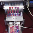 The vf/f/s machine discharges four filled and sealed packs at a time (above). The equipment heat-seals a strip of unprinted film
