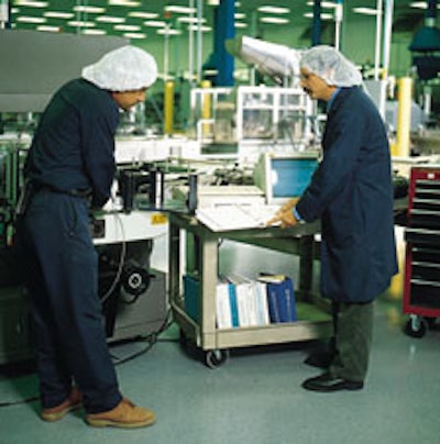 Photo (above) shows Nick Marinaro (at right) running through a training session on a labeler with mechanic Ramon Pichardo. Photo