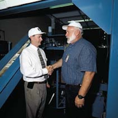 Cooperation between Boyd's (manager Jerry Vawter at left) and OR-OSHA (represented by Mike Lulay) improved worker safety.