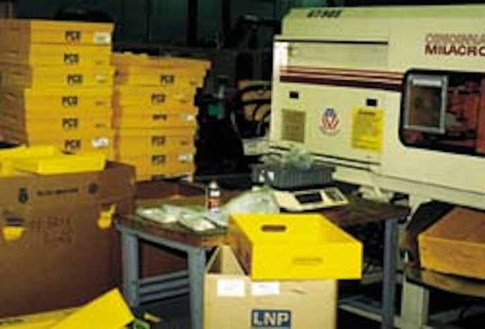At Pitney Bowes' Danbury, CT, plant, plastic corrugated totes are kept by workstations (above) where workers use them to pack in