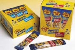 Planters' 'tubed' peanuts are sold at retail in colorful display cartons (above). Photo below left shows the carton infeed stati