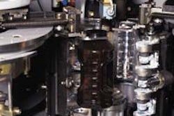 Two views of a blow-molding station show a finished amber container just before discharge (left) and a preform that's just enter