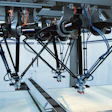 One Control. A single MLC control moves all the robots and does intelligent load balancing.
