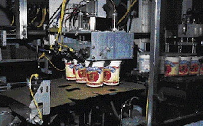 A new cartoning machine erects multipack carton blanks (above), pairs six 4-oz cups of yogurt (right) onto the blank, then wraps