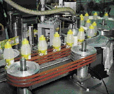 In the station shown above, thermally conditioned injection-molded preforms are being handed off to the portion of the bottle-ma
