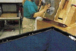 The hardened corner cushions are taken from the molds and placed in plastic bins to be used as needed by the packagers