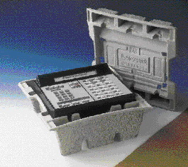 Business telephones like this mock-up are hand-packed by Lucent Technologies into custom-molded pulp top and bottom inserts. The