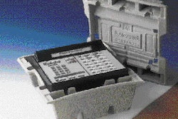 Business telephones like this mock-up are hand-packed by Lucent Technologies into custom-molded pulp top and bottom inserts. The