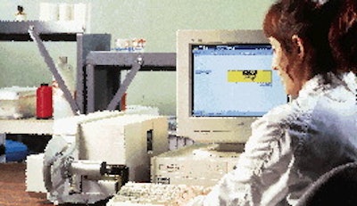An operator inputs the label information into a computer and prints out the labels.