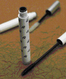 The camera, mounted over the wiper insertion station (above), verifies the presence of wipers in each tube (black insert at the