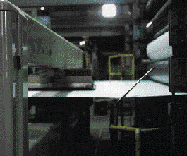 A scanning device traverses a web of linerboard to measure the material?s basis weight and moisture content at the Morrilton mil