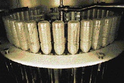Inside the first sterile chamber of the rotary aseptic system, bottles are sterilized with a spray of oxonia