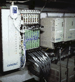 The motion controlller (above, left) is actually a PC with seven dedicated plug-in cards for high-speed control