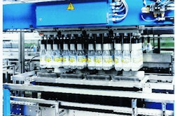 Four crates are filled with each cycle of this machine. Each gripper aligns its bottle so that when bottles land in the crate, l