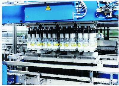Four crates are filled with each cycle of this machine. Each gripper aligns its bottle so that when bottles land in the crate, l