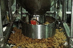 A computer combination weighing system uses scale buckets that deliver accurate fill weights