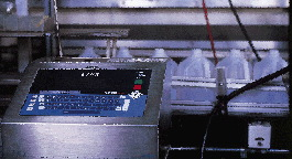 The ink-jet code applied in-line (below and inset) to the shoulder of milk jugs makes it easy for retail store employees and con