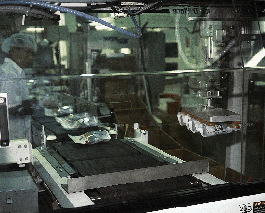 Downstream functions at Ryt-way1s Lakeville, MN, pet food packing plant include robotic case packing (top), case erecting (cent