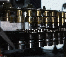 After PET preforms are unscrambled and oriented by an overhead device, they?re sent down this track into a wheel that inverts t