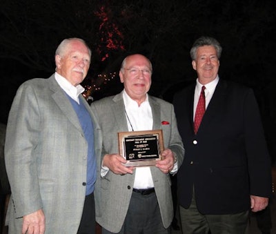 NEW INDUCTEE. Contract Packaging Association Executive Director Ed Landon (left) and President John Riley (right) congratulate S