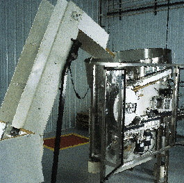 Bottles are conveyed up and into the bowl of the unscrambler thanks to a feeder that Ledge Rock had fabricated locally. The sam