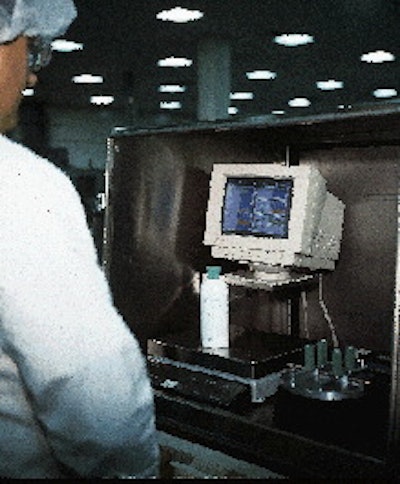 An operator weighs a random sample pulled from the line. The weight is automatically recorded in the computer