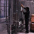 An operator loads ends into a vertical pocket on one of nine Rotofeeder machines located on a mezzanine level at La Coste?a (lef