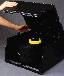 Disposable packaging (left) used formerly by 3M for its bulk videotape generated about 1 cu? of waste. The Reusable Pak (above)